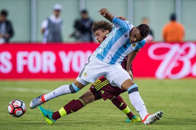 18 June 2016: Argentina midfielder Nicolas Gaitan (20) tries to go around Venezuela defender Rolf Feltscher (20) in the second half during the Copa America Centenario quarterfinal match between the Argentina and Venezuela played at Gillette Stadium in Foxborough, MA. (Photo by Dennis Schneidler Icon Sportswire) SOCCER: JUN 18 Copa America Centenario - Quarterfinal - Argentina v Venezuela Icon0618160760 EDITORIAL USE ONLY
