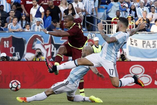 18 June 2016: Argentina midfielder Javier Mascherano (14) and Argentina defender Nicolas Otamendi (17) can not stop the shot from Venezuela forward Salomon Rondon (9). Argentina defeated Venezuela 4-1 in the quarterfinal of the 2016 Copa America Centenario at Gillette Stadium in Foxborough, Massachusetts. (Photograph by Fred Kfoury III Icon Sportswire) SOCCER: JUN 18 Copa America Centenario - Quarterfinal - Argentina v Venezuela Icon482160618018 EDITORIAL USE ONLY