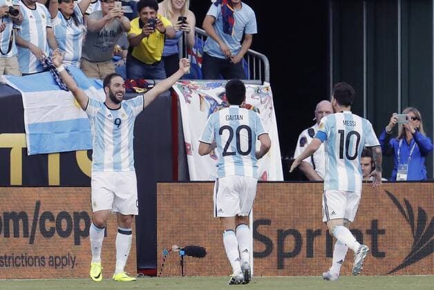 18 June 2016: Argentina forward Gonzalo Higuain (9) celebrates his second goal of the game as Argentina forward Nicolas Gaitan (20) and Argentina forward Lionel Messi (10) rush in with congratulations. Argentina defeated Venezuela 4-1 in the quarterfinal of the 2016 Copa America Centenario at Gillette Stadium in Foxborough, Massachusetts. (Photograph by Fred Kfoury III Icon Sportswire) SOCCER: JUN 18 Copa America Centenario - Quarterfinal - Argentina v Venezuela Icon482160618021 EDITORIAL USE ONLY
