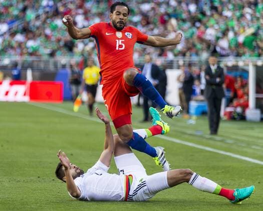 June 18, 2016: Chile midfielder Jean Beausejour (15) tackled by Mexico defender Nestor Araujo (2) during the first half of the Copa Centenario quarter final match between Mexico and Chile held at Levi s Stadium in Santa Clara CA. Final score MEX- 0, CHI- 7.(Photo by Allan Hamilton ICON Sportswire) SOCCER: JUN 18 Copa America Centenario - Quarterfinal - Mexico v Chile Icon16061819 EDITORIAL USE ONLY