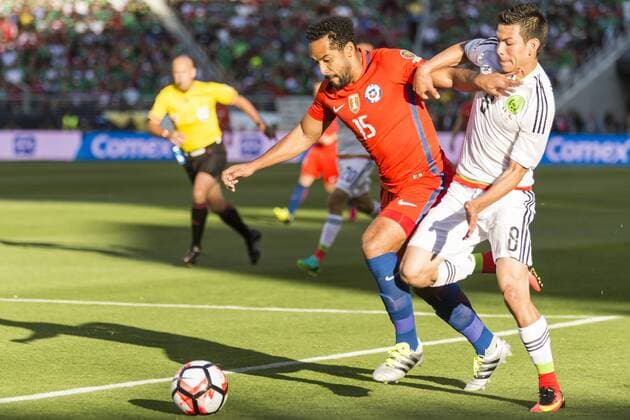 June 18, 2016: Chile midfielder Jean Beausejour (15) moves past Mexico midfielder Hirving Lozano (8) during the first half of the Copa Centenario quarter final match between Mexico and Chile held at Levi s Stadium in Santa Clara CA. Final score MEX- 0, CHI- 7.(Photo by Allan Hamilton ICON Sportswire) SOCCER: JUN 18 Copa America Centenario - Quarterfinal - Mexico v Chile Icon16061820 EDITORIAL USE ONLY