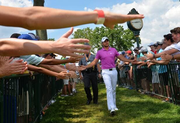 Patrons hold out there hands as Jason Day of Australia walks to the first tee box in the final round at the U.S. Open at Oakmont Country Club near Pittsburgh, Pennsylvania on June 19, 2016.  OAK20160619809 KEVINxDIETSCH