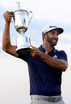 Dustin Johnson celebrates with the Championship Trophy on the 18th green after winning his first major championship in the final round at the U.S. Open at Oakmont Country Club near Pittsburgh, Pennsylvania on June 19, 2016. Johnson won with a score of 5 under par.  OAK20160619324 ARCHIExCARPENTER