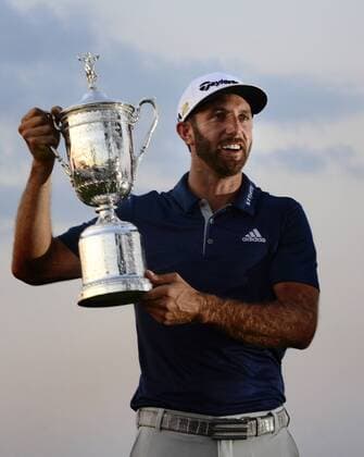 Dustin Johnson poses with the Championship Trophy on the 18th green after winning his first major championship in the final round at the U.S. Open at Oakmont Country Club near Pittsburgh, Pennsylvania on June 19, 2016. Johnson won with a score of 5 under par.  OAK20160619332 ARCHIExCARPENTER