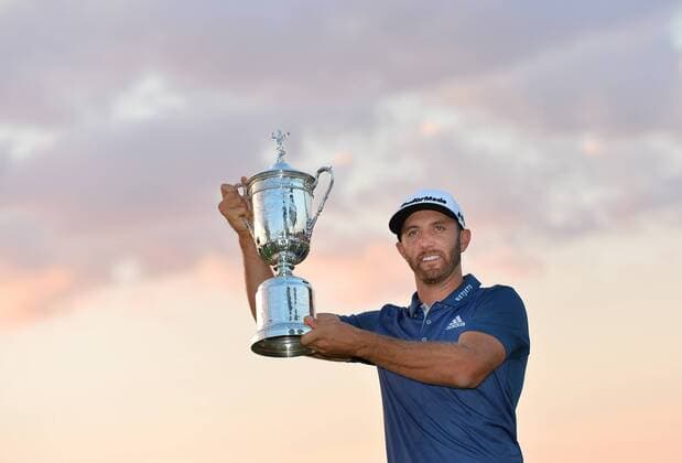 Dustin Johnson holds the Championship Trophy on the 18th green after winning his first major championship in the final round at the U.S. Open at Oakmont Country Club near Pittsburgh, Pennsylvania on June 19, 2016. Johnson won with a score of 5 under par.  OAK20160619723 KEVINxDIETSCH