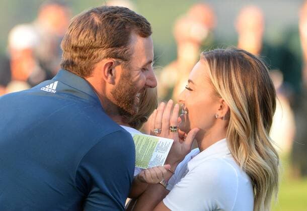 Dustin Johnson celebrates with Paulina Gretzky and son Tatum on the 18th green after making a birdie putt and winning his first major championship in the final round at the U.S. Open at Oakmont Country Club near Pittsburgh, Pennsylvania on June 19, 2016. Johnson won with a score of 5 under par.  OAK20160619872 PATxBENIC