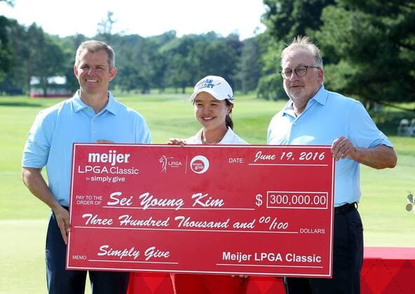 June 19, 2016 - Belmont, Michigan, United States - See Young Kim of Seoul is presented with a check by Rick Keyes, left, and Doug Meijer, right, after winning the final round of the Meijer LPGA Golf Damen Classic golf tournament at Blythefield Country Club in Belmont, MI, USA Sunday, June 19, 2016. Meijer LPGA Classic - ZUMAn230