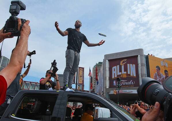 June 22, 2016 - Cleveland, Ohio, U.S. - The Cleveland Cavaliers KYRIE IRVING stands atop a parade vehicle to greet fans in front of Quicken Loans Arena in Cleveland during the team s NBA Basketball Herren USA Championship celebration. NBA 2016 - Cleveland Cavaliers NBA Championship Parade - ZUMAm67_