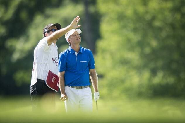 Billy Hurley III and his caddie discuss wind direction on the 9th hole at the Quicken Loans National golf tournament at Congressional CC in Bethesda, Maryland on June 26, 2016. Hurley, of Annapolis, Maryland, shot a 2-under 69 on Sunday for his first tournament win.  WAP201606260386 PETExMAROVICH