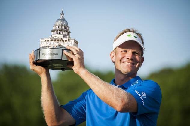 Billy Hurley III, of Annapolis, Maryland, holds the Quicken Loans National Trophy following the final round of the Quicken Loans National golf tournament at Congressional CC in Bethesda, Maryland on Sunday, June 36, 2016. Hurley shot a 2-under 69 on Sunday for his first tournament win.  WAP201606261130 PETExMAROVICH