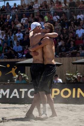 26 June 2016: Casey Patterson (right) embraces teammate Jake Gibb after the duo beat Stafford Slick and John Mayer to advance to the championship match during the AVP San Francisco Open in San Francisco, CA. (Photo by Hailey Archambault Icon Sportswire) VOLLEYBALL: JUN 26 AVP San Francisco Open Icon160626415 EDITORIAL USE ONLY