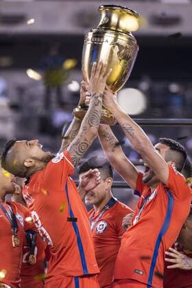 East Rutherford, New Jersey, U.S - Chile midfielder ARTURO VIDAL (8) & Chile defender MAURICIO ISLA (4) lift the Copa America trophy at the Copa America Centenario 2016 Final at MetLife Stadium in East Rutherford, NJ Soccer 2016 - Copa America Centenario Final Chile defeats Argentina 0-0 (4-2) Penalty Shoot out. - ZUMAs192