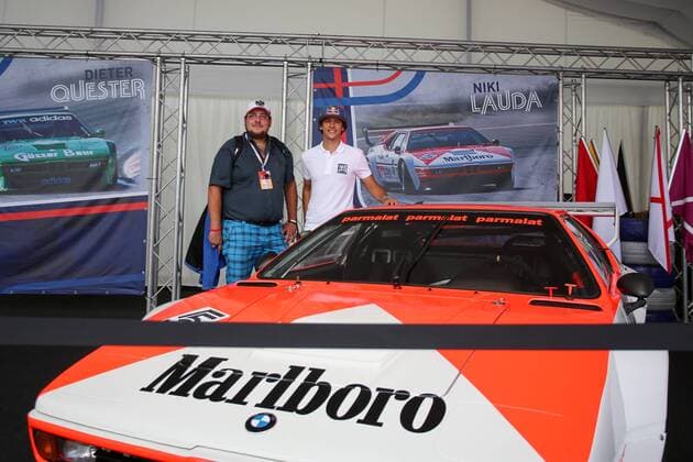 FORMULA 1 - GP of Austria 2016 SPIELBERG,AUSTRIA,30.JUN.16 - MOTORSPORTS, FORMULA 1 - Grand Prix of Austria, Red Bull Ring, preview. Image shows Patrick Friesacher (AUT) with fan and the old BMW M1 Procar car driven by Niki Lauda. GEPAxpictures xMaticxKlansek