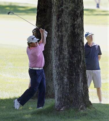 June 30, 2016 - Akron, OH, USA - William McGirt hits out of the rough between trees on the 18th fairway during the first round of the Bridgestone Invitational at Firestone Country Club in Akron, Ohio, on Thursday, June 30, 2016. Bridgestone Invitational at Firestone Country Club, first round - ZUMAm67_