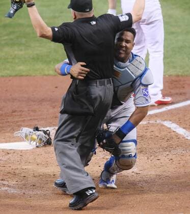 June 30, 2016 - St Louis, MO, USA - Kansas City Royals catcher Salvador Perez collides with home plate umpire Mike Everitt as he turns to chase a foul ball off the bat of the St. Louis Cardinals Mike Leake in the fourth inning on Thursday, June 30, 2016, at Busch Stadium in St. Louis. The Royals won, 4-2. Kansas City Royals at St. Louis Cardinals - ZUMAm67_