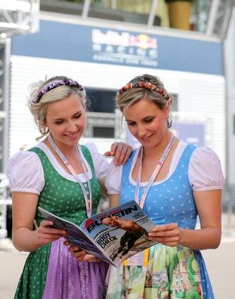 FORMULA 1 - GP of Austria 2016 SPIELBERG,AUSTRIA,01.JUL.16 - MOTORSPORTS, FORMULA 1 - Grand Prix of Austria, Red Bull Ring, free practice. Image shows the hostesses with The Red Bulletin. GEPAxpictures xMaticxKlansek
