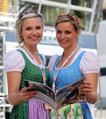 FORMULA 1 - GP of Austria 2016 SPIELBERG,AUSTRIA,01.JUL.16 - MOTORSPORTS, FORMULA 1 - Grand Prix of Austria, Red Bull Ring, free practice. Image shows the hostesses with The Red Bulletin. GEPAxpictures xMaticxKlansek