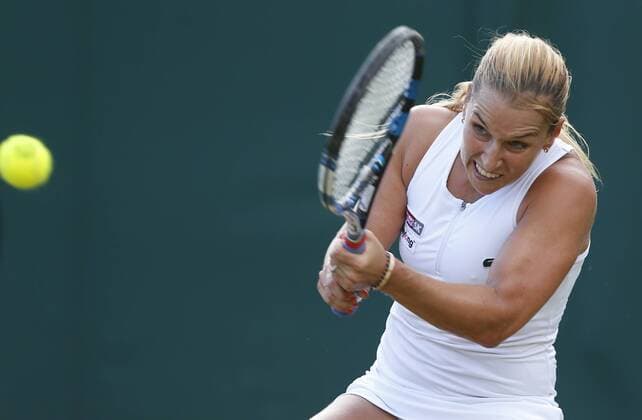 (160703) -- LONDON, July 3, 2016 -- Dominika Cibulkova of Slovakia hits a return to Eugenie Bouchard of Canada during their women s singles third round match at the Wimbledon Tennis Championships in London, Britain, on July 2, 2016. Cibulkova won 2-0.) (SP)BRITAIN-LONDON-TENNIS-WIMBLEDON-DAY 6 YexPingfan 