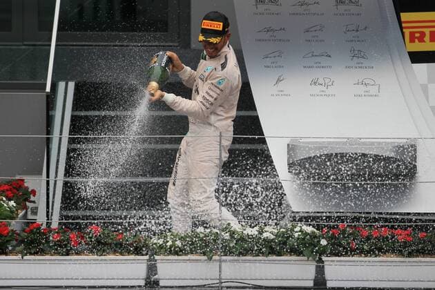 03.07.2016. Red Bull Circuit, Spielberg, Austria. F1 Grand pix of Austria. Race Day. Lewis Hamilton sprays champagne from the podium as he wins at the Red Bull Ring xLeannexBoonx  ActionPlus11757903