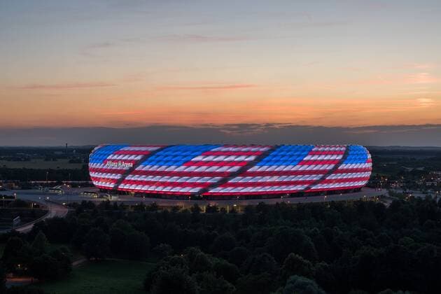 MUNICH, GERMANY - JULY 04: The Allianz Arena is illuminated with the flag of the United States of America to celebrate the Independance Day on July 4, 2016 in Munich, Germany.