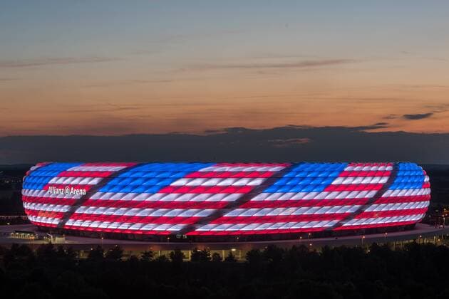 MUNICH, GERMANY - JULY 04: The Allianz Arena is illuminated with the flag of the United States of America to celebrate the Independance Day on July 4, 2016 in Munich, Germany.