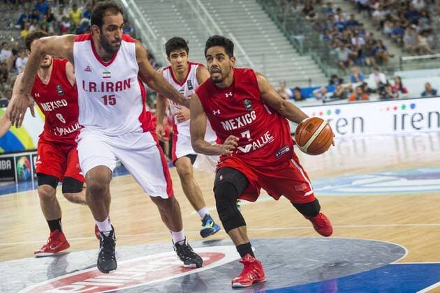 July 5, 2016 - Turin, Italy - The iranian power forward Hamed Hadadi defends against a drive to the basket by The mexican point guard Jorge Ivan Gutierrez in the match between Mexico and Iran at 2016 FIBA Olympic Qualifying Tournament in Turin, Italy on July 5, 2016. FIBA Qualifying Tournament: Mexico v Iran  - ZUMAn230