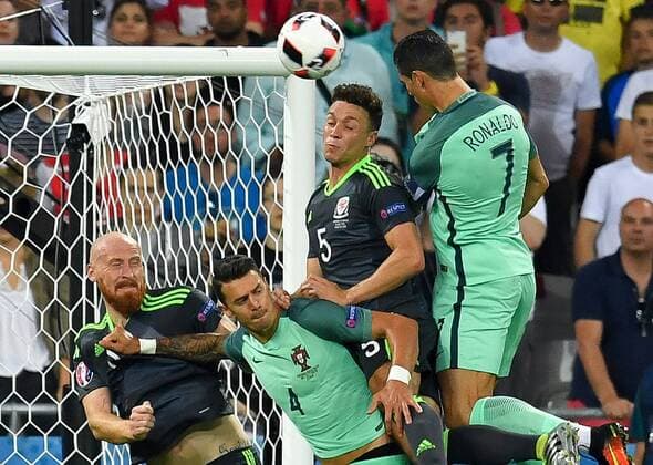 SOCCER - UEFA EURO EM Europameisterschaft Fussball 2016, POR vs WAL LYON,FRANCE,06.JUL.16 - SOCCER - UEFA European Championship EM Europameisterschaft 2016, semifinals, international match Länderspiel Portugal vs Wales. Image shows James Collins (WAL), Jose Fonte (POR), James Chester (WAL) and Cristiano Ronaldo (POR). Keywords: goal. GEPAxpictures xFlorianxErtl
