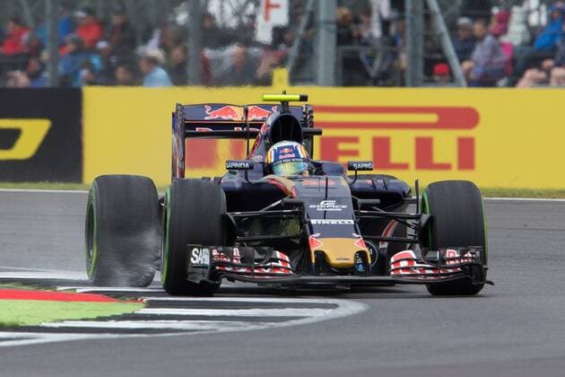 09.07.2016. Silverstone, Northants, England. Formula One British Grand Prix Qualifying on a damp circuit. Scuderia Toro Rosso driver Carlos Sainz Jr kicks up water from the kerb. xTimxWilliamsx  ActionPlus11759838