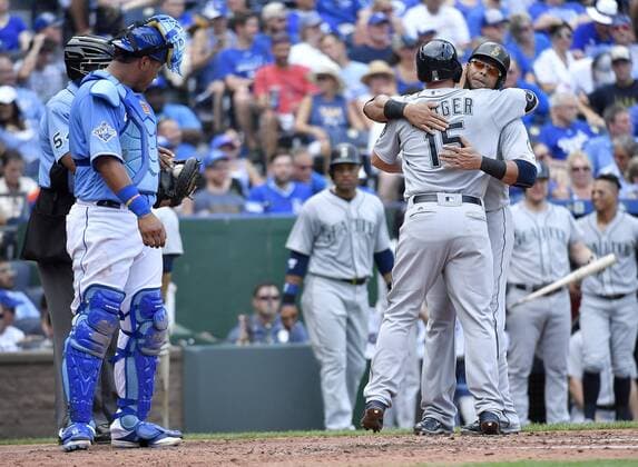 July 9, 2016 - Kansas City, MO, USA - Kansas City Royals catcher Salvador Perez, left, gets a new ball as the Seattle Mariners Kyle Seager is congratulated by Nelson Cruz after hitting a three-run home run in the fourth inning on Saturday, July 9, 2016, at Kauffman Stadium in Kansas City, Mo. Seattle at Kansas City - ZUMAm67_