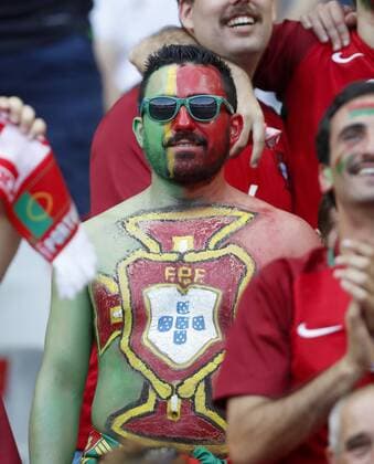 Fan, Fans, Fussballfans, supporters, spectators, Zuschauer, Jacke, Kutte, Weste, Fankurve, Schals Fanschals, Maske, Verkleidung, Bemalung im Gesicht, Gesichtsbemalung, Schminke , Bodypainting, Pokal, nackter Oberkoerper, Body, Bauchmuskeln, Sixpack, Muskulatur, Körper, Muskeln, FRANCE - PORTUGAL Final ,Football European Championships EURO at 10 July, 2016 in Paris, Stade de France. Fussball, Nationalteam, Finale, 10.07.2016, Frankreich