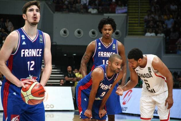 July 10, 2016 - Philippines - Tony parker chats with Cory Joseph (R) while Nando de Colo prepares to shoot a free throw. France and Canada battled at the Mall of Asia Arena in Pasay City for the FIBA Olympic Qualifying Tournament. France advances to the Olympics by winning the last slot of the qualifying tournament with 83 points versus CanadaÃ¢â‚¬â ¢s 74. World News - July 10, 2016 - ZUMAs166