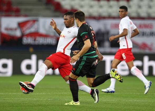 SOCCER - CL quali, RBS vs Liepaja SALZBURG,AUSTRIA,12.JUL.16 - SOCCER - UEFA Champions League, qualification, Red Bull Salzburg vs FK Liepaja. Image shows Paulo Miranda (RBS) and Toms Gucs (Liepaja). GEPAxpictures xHaraldxSteiner