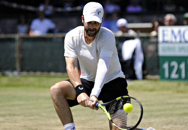 July 13, 2016: Brian Baker (USA) gets low to hit a backhand in his round of 16 match vs. Marcos Baghdatis (CYP) at the 2016 Hall of Fame Championships held at the Casino at Newport, R.I. This ATP Tennis Herren match was won by Baghdatis 6-4, 6-3. Tennis 2016: Hall of Fame Championships JUL, 16 - ZUMAc04_