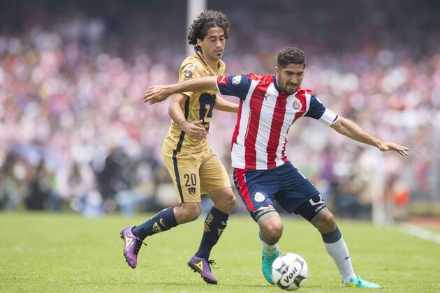 Sunday, July 17, 2016: Pumas Matias Britos, left, challenges Chivas Jair Pereira during a Mexican soccer league match between Pumas UNAM and Chivas de Guadalajara held at Estadio OloÂ­mpico Universitario in Mexico City. Sports - July 17, 2016 - ZUMAc04_