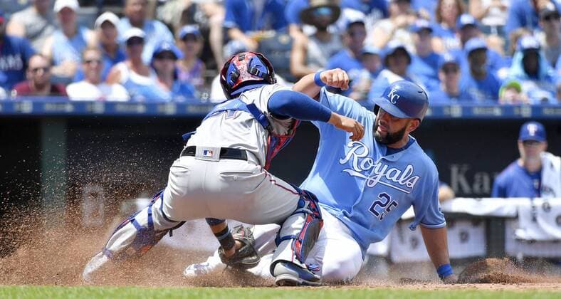 July 24, 2016 - Kansas City, MO, USA - Kansas City Royals Kendrys Morales is tagged out at home plate by Texas Rangers catcher Robinson Chirinos on a fielders choice hit into by Whit Merrifield in the second inning Sunday, July 24, 2016 at Kauffman Stadium in Kansas City, Mo. Royals fall to Rangers after Soria stumbles again - ZUMAm67_