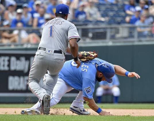 July 24, 2016 - Kansas City, MO, USA - Kansas City Royals Kendrys Morales is tagged out by Texas Rangers shortstop Elvis Andrus on a rundown between second and third on a fielders choice hit into by Alex Gordon in the sixth inning Sunday, July 24, 2016 at Kauffman Stadium in Kansas City, Mo. Royals fall to Rangers after Soria stumbles again - ZUMAm67_