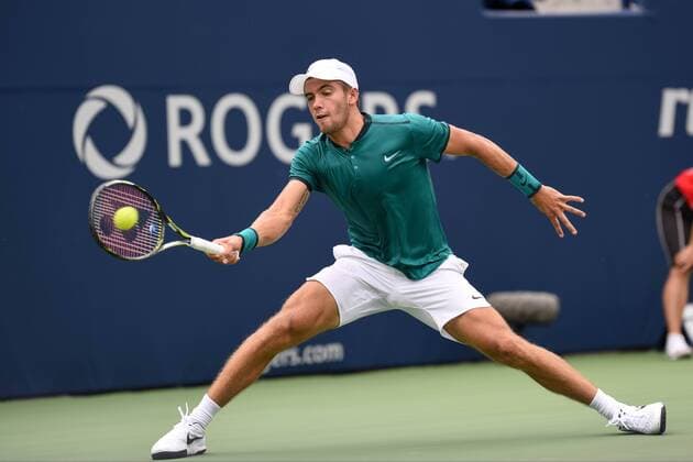 July 25, 2016: Borna Coric of Croatia returns the ball to Ivan Dodig of Croatia during their first round match of the Rogers Cup tournament at the Aviva Centre in Toronto, Ontario, Canada on July 25, 2016. Cal Media TENNIS 2016 - Rogers Cup Toronto July 25 - ZUMAc04_
