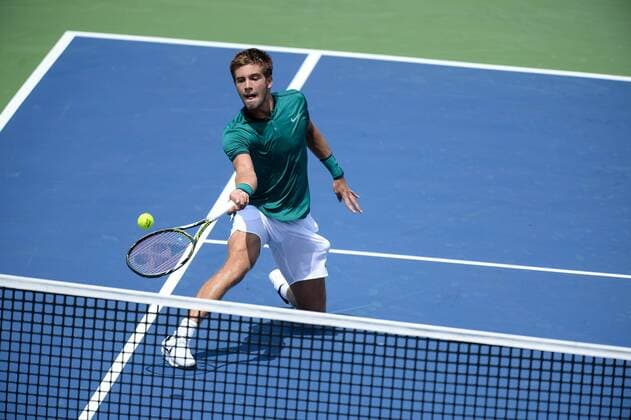July 25, 2016: Borna Coric of Croatia returns the ball to Ivan Dodig of Croatia during their first round match of the Rogers Cup tournament at the Aviva Centre in Toronto, Ontario, Canada on July 25, 2016. Cal Media TENNIS 2016 - Rogers Cup Toronto July 25 - ZUMAc04_