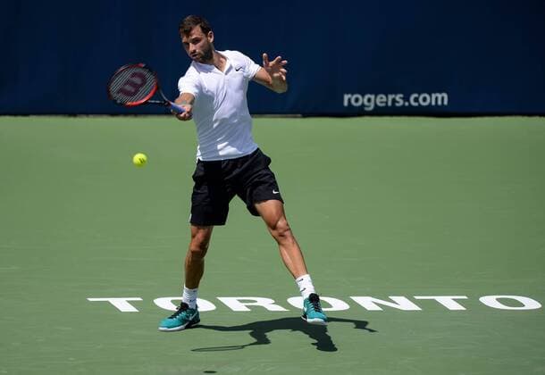 July 25, 2016: Grigor Dimitrov of Bulgaria returns the ball to Yuichi Sugita of Japan during their first round match of the Rogers Cup tournament at the Aviva Centre in Toronto, Ontario, Canada on July 25, 2016. Cal Media TENNIS 2016 - Rogers Cup Toronto July 25 - ZUMAc04_