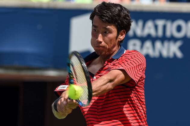 July 25, 2016: Yuichi Sugita of Japan returns the ball to Grigor Dimitrov of Bulgaria during their first round match of the Rogers Cup tournament at the Aviva Centre in Toronto, Ontario, Canada on July 25, 2016. Cal Media TENNIS 2016 - Rogers Cup Toronto July 25 - ZUMAc04_