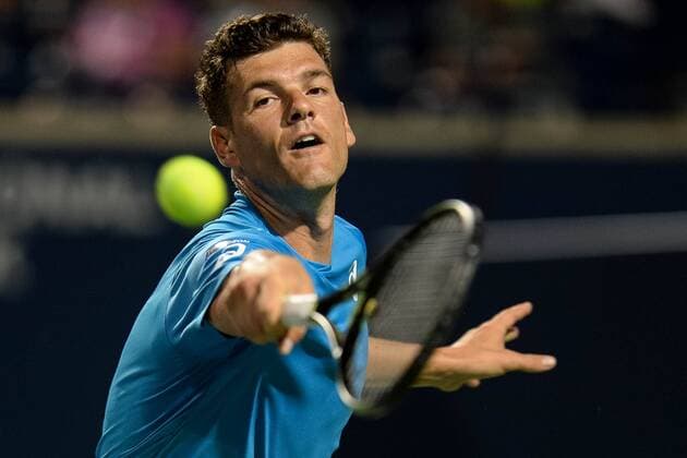 July 25, 2016: Frank Dancevic of Canada returns the ball to Sam Querrey of the United States during their first round match of the Rogers Cup tournament at the Aviva Centre in Toronto, Ontario, Canada on July 25, 2016. Cal Media TENNIS 2016 - Rogers Cup Toronto July 25 - ZUMAc04_