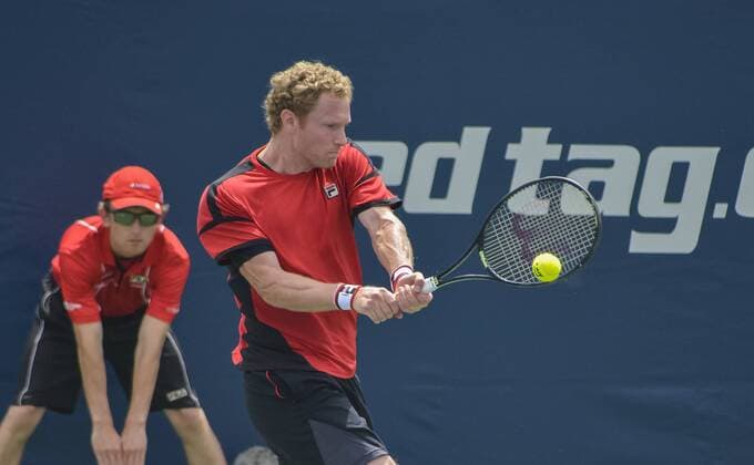 July 25, 2016 - Toronto, Ontario, Canada - Gilles Miller (White shirt) from Luxemburg defeats Dmitry Tursunov (Red Shirt) from Russia in 2 sets, advancing to the secound round of Rogers Cup Tennis Tournament in Toronto, Canada. Gilles Miller (White shirt) from Luxemburg defeats Dmitry Tursunov (Red Shirt) from Russia in 2 sets, advancing to the secound round of Rogers Cup Tennis Tournament in Toronto, Canada. - ZUMAd114