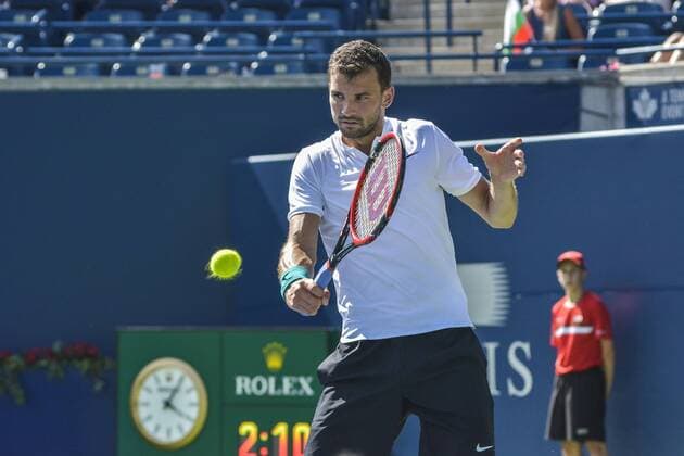 July 25, 2016 - Toronto, Ontario, Canada - Grigor Dimitrov from Bulgaria (White Shirt) defeats Yuichi Sugita from Japan, advancing to second round of Rogers Cup of Tennis in Toronto, Canada. Grigor Dimitrov from Bulgaria (White Shirt) defeats Yuichi Sugita from Japan, advancing to second round of Rogers Cup of Tennis in Toronto, Canada. - ZUMAd114