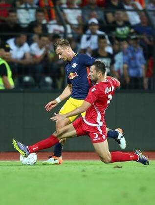 SOCCER - CL, quali, Tirana vs RBS ELBASAN,ALBANIA,26.JUL.16 - SOCCER - UEFA Champions League, qualification, FK Partizani Tirana vs Red Bull Salzburg. Image shows Fredrik Gulbrandsen (RBS) and Renato Arapi (Tirana). GEPAxpictures xFelixxRoittner