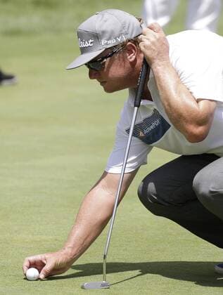 Charley Hoffman lines up a putt on a practice green in practice at the PGA Golf Herren Championship at Baltusrol Golf Club in Springfield, New Jersey on July 26, 2016.  PGA20160726107 JOHNxANGELILLO
