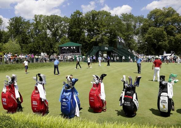 Bags of clubs including ones from Dustin Johnson and Rory McIlroy stand on the edge of the practice green at the PGA Golf Herren Championship at Baltusrol Golf Club in Springfield, New Jersey on July 26, 2016.  PGA20160726108 JOHNxANGELILLO