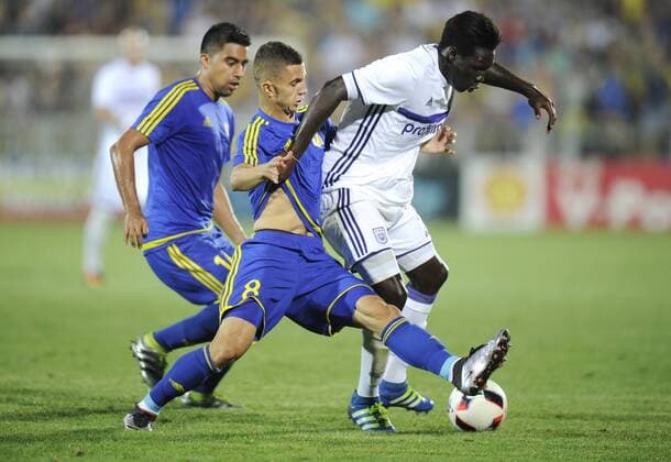 ROSTOV-ON-DON, RUSSIA - JULY 26, 2016: Rostov s Alexander Bukharov, Igor Kireyev and Anderlecht s Fabrice N Sakala (L-R) fight for the ball in Leg 1 of their 2016 17 UEFA Champions League Third qualifying round match at Olimp-2 Stadium. The game ended in a 2:2 draw. Valery Matytsin TASS  TS02AF36