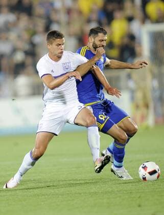 ROSTOV-ON-DON, RUSSIA - JULY 26, 2016: Anderlecht s Leander Dendoncker (L) and Rostov s Alexandru Gatcan fight for the ball in Leg 1 of their 2016 17 UEFA Champions League Third qualifying round match at Olimp-2 Stadium. The game ended in a 2:2 draw. Valery Matytsin TASS  TS02AF3F