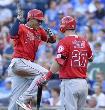 July 26, 2016 - Kansas City, MO, USA - The Los Angeles Angels Yunel Escobar celebrates with Mike Trout after Escobar scored on a double by Kole Calhoun in the first inning against the Kansas City Royals on Tuesday, July 26, 2016, at Kauffman Stadium in Kansas City, Mo. LA Angels at Kansas City - ZUMAm67_