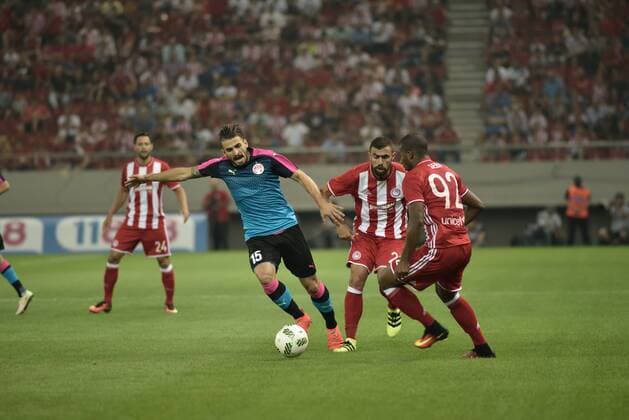 Greece: Olympiacos vs Hapoel Beer-Sheva (0-0) Rozenfeld Broun (no 15) of Hapoel Beer-Sheva tries to avoid Ioannis Maniatis (no 2) and Seba (no 92) of Olympiacos.  DimitriosxKarvountzis PacificxPress